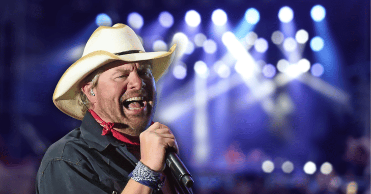 Musician wearing a cowboy hat during a live show