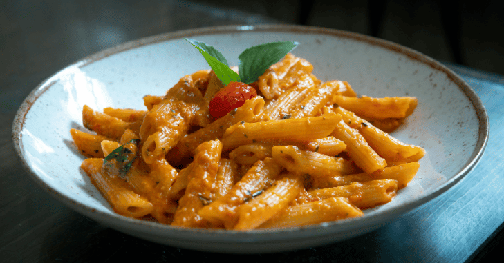 Penne alla vodka served on a white plate