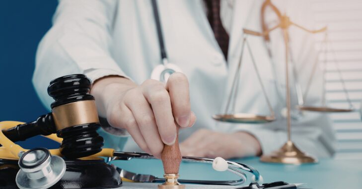 Person signing a legal complaint form